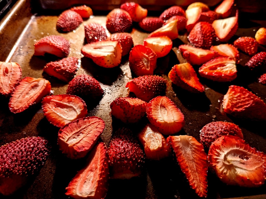 strawberries roasting on an oven tray